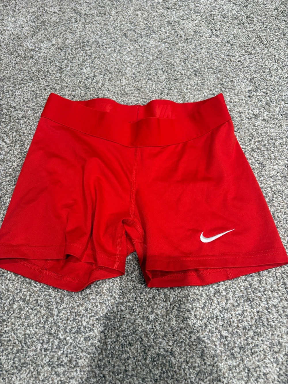 Nike Women's Red Athletic Stretch Shorts with White Swoosh